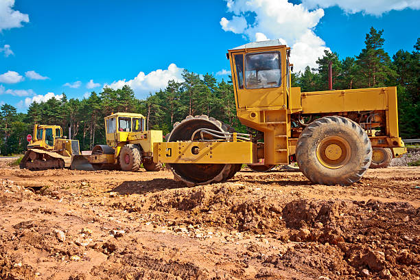 Steamrollers and bulldozer on a road construction Steamrollers and bulldozer on a road construction