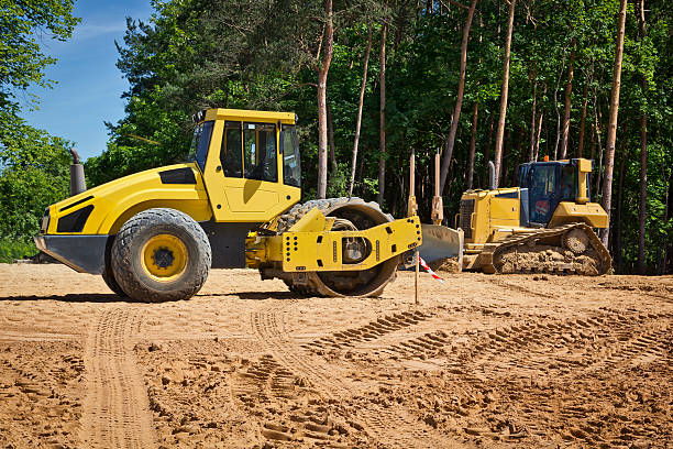 Steamroller and bulldozer on a road construction